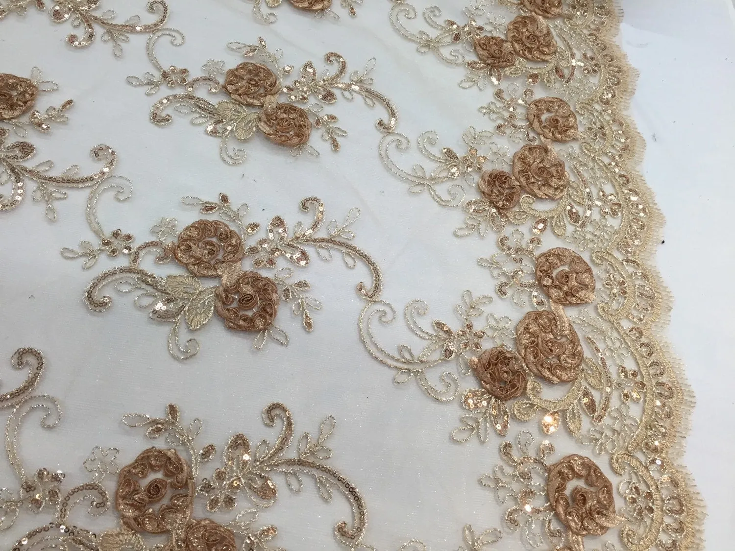 Camel 3d flowers embroider with sequins on a mesh lace fabric. Sold by the yard.